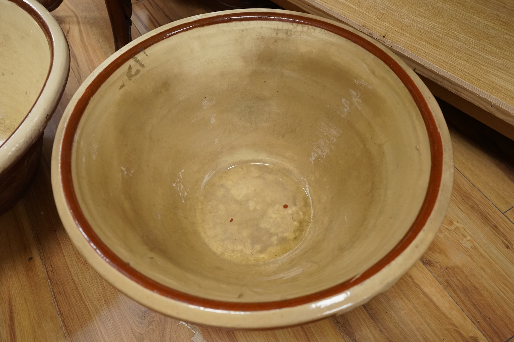 A pair of large slipware dairy bowls, 44cm diameter